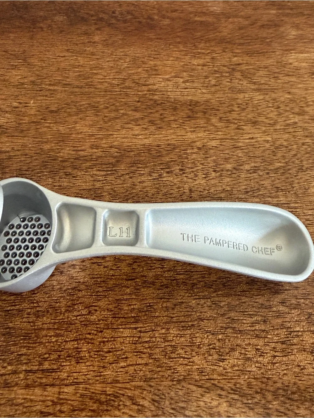 The PAMPERED CHEF Cast Aluminum Garlic Press